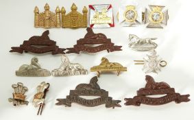 Sixteen British Army Linconshire Regiment, Cambridgeshire Regiment etc metal collar badges in four