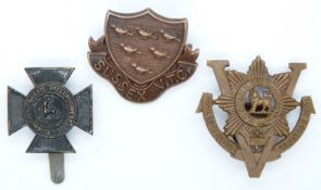 Three British Army Derbyshire, Sussex and Worcestershire Regiment Volunteers metal badges