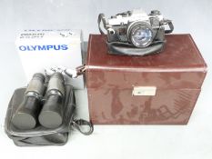 Olympus OM10 SLR camera with 1:1.8 f=50mm lens, Bell & Howell 1:4.5 80-205mm lens, MC7 Teleplus 2x