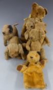 Seven various Teddy bears including a Sooty hand puppet and two dogs, largest 47cm tall.
