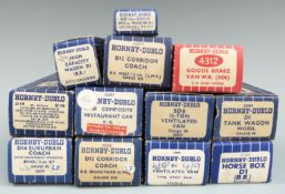 Twelve Hornby Dublo 00 gauge coaches, wagons, tankers and vans, all in original boxes.