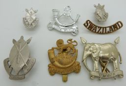 Seven African military badges including Tanzanian Rifles, Malawi Rifles etc, one by Firmin