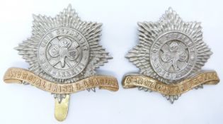 Two British Army 4th Royal Irish Dragoon Guards bi-metal cap badges