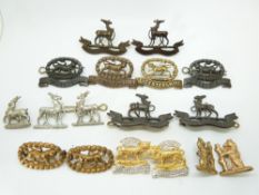 Seventeen British Army Royal Warwickshire Regiment and Leicestershire Regiment metal collar badges