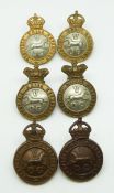 Six British Army 5th Dragoon Guards metal collar badges with Victorian and Imperial crowns
