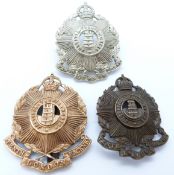 Three British Army 10th County of London (Hackney) metal cap badges