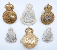 Six British Army Royal Military College officer cadet's George VI cap badges