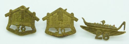 Three New Zealand Army WWI pair of 30th Reinforcements metal badges together with a 26th