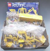 Lego Technic Backhoe Grader building set 8862 together with various loose Lego parts, a box for