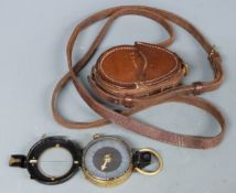 WWI military marching compass, dated 1918 with leather case inscribed CAPT.T.E Evans Quarter Master