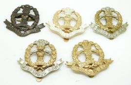 Five British Army Middlesex Regiment metal cap badges including an all brass example