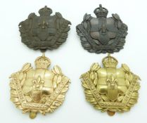 Four British Army Lincolnshire Yeomanry metal cap badges including an Imperial Yeomanry example