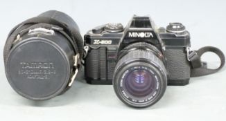 Minolta X-500 SLR camera with Sigma 1:2.8-4 f=35-70mm and 1:4.5 f=100-200mm lenses