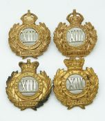 Four British Army 13th Hussars metal badges with Imperial and Queen's crowns