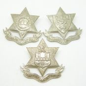 Three various Barbados Cadet Corps metal cap badges, including a Combermore School example