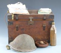 A storage trunk with hinged lid, lock and carrying handles together with contents including aircraft