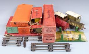 A collection of Hornby 0 gauge wagons, coaches and accessories including an LNER bogie cattle wagon,