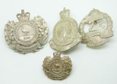 Four Australian Army Mounted Infantry metal badges for the Queensland, South Australian and