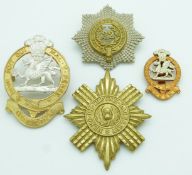 Four British Army Queen's Division, Cheshire Regiment and Scots Guards metal badges, one by Gaunt