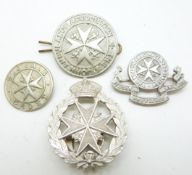 Four St. John Ambulance Association badges including a sterling silver example together with