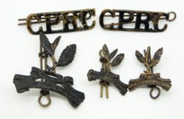 British Army Ceylon Planters Rifle Corps metal badge set comprising cap badger collar badges and