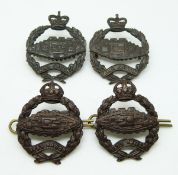 Four British Army OSD metal badges in two pairs for the Tank Corps with Imperial crown and St