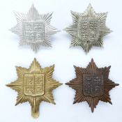 Four British Army 13th County of London Battalion (Kensington) metal cap badges