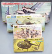 Four Revell 1:32 scale plastic model kits comprising Messerschmitt BF110-G-4, Bell UH-1D Huey