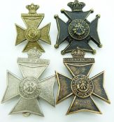 Four British Army Kings Royal Rifle Corps metal hat badges