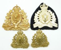 Four Canada Royal Canadian Mounted Police badges including a pair of collar badges, one stamped J.