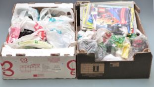 Over 10kg of loose Lego pieces including boards and a selection of instructions and plans.