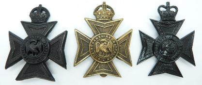 Three British Army Buckinghamshire Battalion metal hat badges including an officer's example