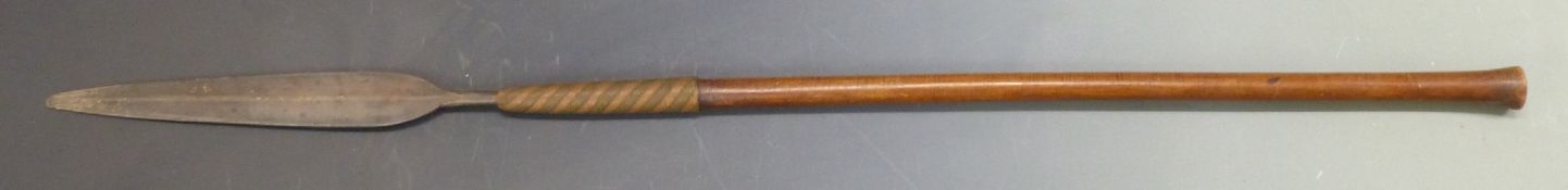 A 19th/20thC African thrusting spear with zebra wood handle and braided copper and brass wire
