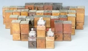 Thirty-six copper cased glass apothecary or chemist's bottles, height of tallest 13.5cm.