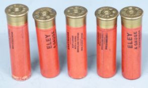 Four Eley 4 bore shotgun cartridges and one empty cartridge case. PLEASE NOTE THAT A VALID