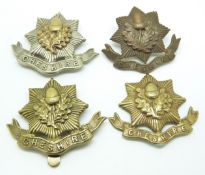 Four British Army Cheshire Regiment metal cap badges
