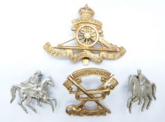 Four Oxford University Officer Training Corps badges including a pair of Cavalry collar badges
