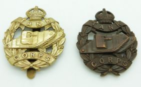 Two British Army Tank Corps officer's bronze cap badges together with similar example
