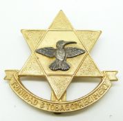 British Commonwealth Trinidad and Tobago Regiment officer's silver and gilt cap badge marked YDL T/