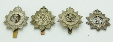 Four British Army North Somerset Yeomanry metal cap badges