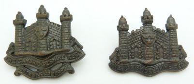 Two British Army Cambridgeshire Regiment officer's cap badges together with another similar example