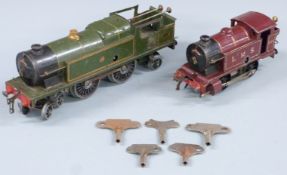 Hornby 0 gauge clockwork 4-4-2 tank locomotive in GWR livery together with an LMS liveried 0-4-0