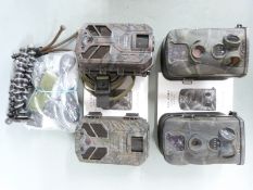 Four trail cameras comprising two Apeman and two Ltl Acorn, with instructions, tripods etc