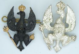 Two British Army 14th/20th Hussars metal cap badges