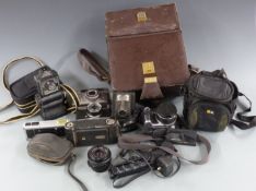 Quantity of cameras to include Zeiss Ikon folding camera, Ensign Ful-Vue, Olympus Trip 35, Sony