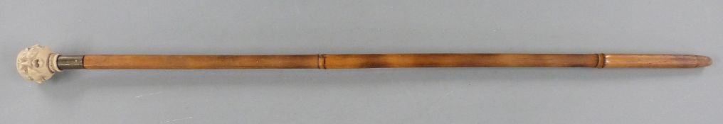 Bamboo swordstick with handle formed as four faces with different expressions, and a hexagonal