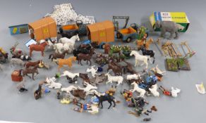 A collection of Britains diecast model farm vehicles, accessories and animals including an Indian