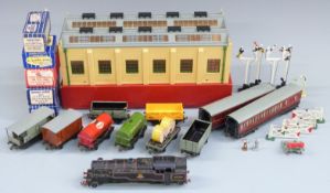 A collection of Hornby Dublo 00 gauge locomotives, coaches, wagons, tankers, vans and accessories