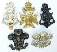 Five British Army 11th, 15th and 21st County of London Battalion metal cap badges