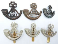 Six British Army King's Shropshire Light Infantry Regiment metal badges